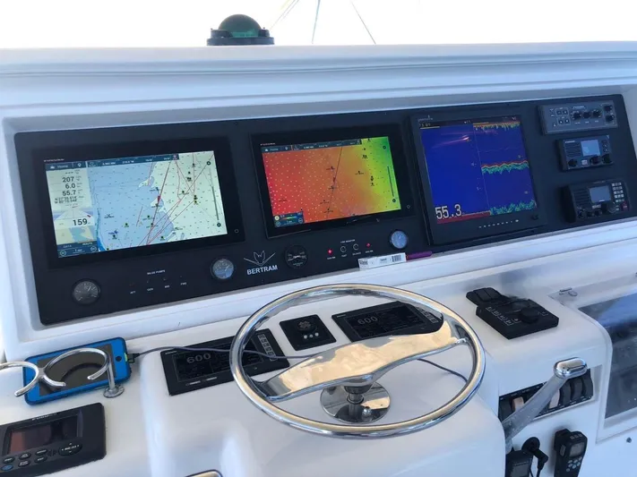 Quite Nice Yacht Photos Pics Control panel of a 2004 Bertram 570 Convertible yacht with navigation screens.