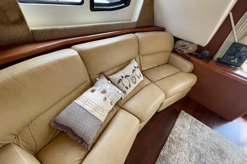  Yacht Photos Pics Luxurious beige leather sofa with decorative pillows in a 2005 Silverton 43 Sport Bridge yacht.