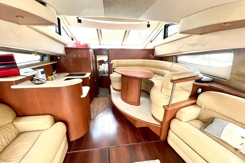  Yacht Photos Pics Luxurious interior of a 2005 Silverton 43 Sport Bridge yacht with elegant seating and wood finishes.