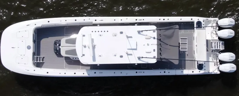  Yacht Photos Pics Overhead view of 2022 Invincible 46 Catamaran on water, showcasing sleek design and multiple engines.