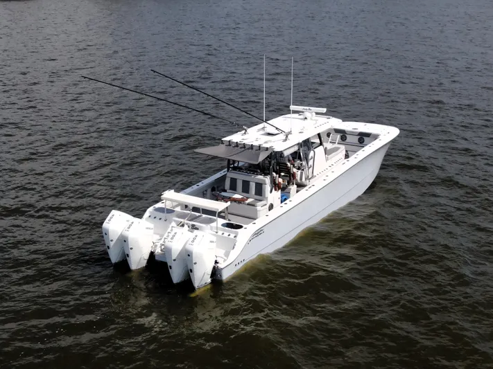  Yacht Photos Pics 2022 Invincible 46 Catamaran on water, featuring multiple outboard engines.