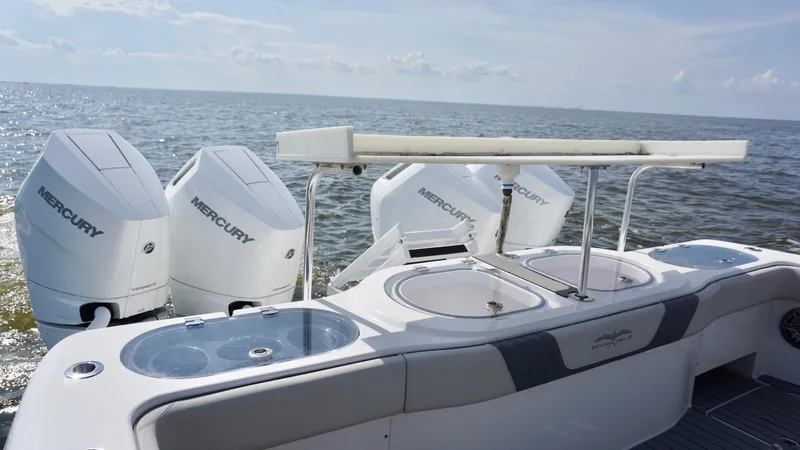  Yacht Photos Pics 2022 Invincible 46 Catamaran with Mercury engines on open water.