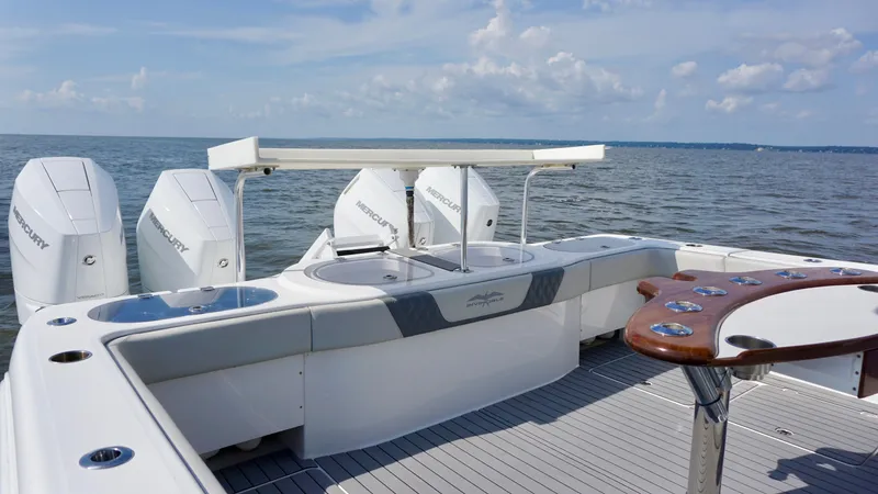  Yacht Photos Pics 2022 Invincible 46 Catamaran with Mercury engines on open water.