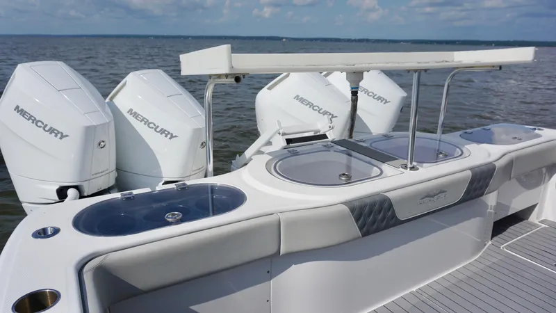  Yacht Photos Pics 2022 Invincible 46 Catamaran with Mercury engines, featuring a sleek fishing station.