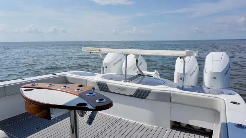  Yacht Photos Pics 2022 Invincible 46 Catamaran with Mercury engines on open sea.