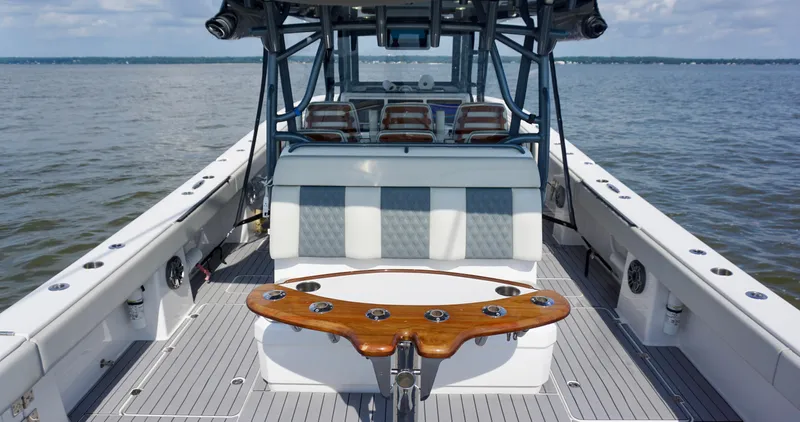  Yacht Photos Pics 2022 Invincible 46 Catamaran on water, featuring spacious deck and seating area.