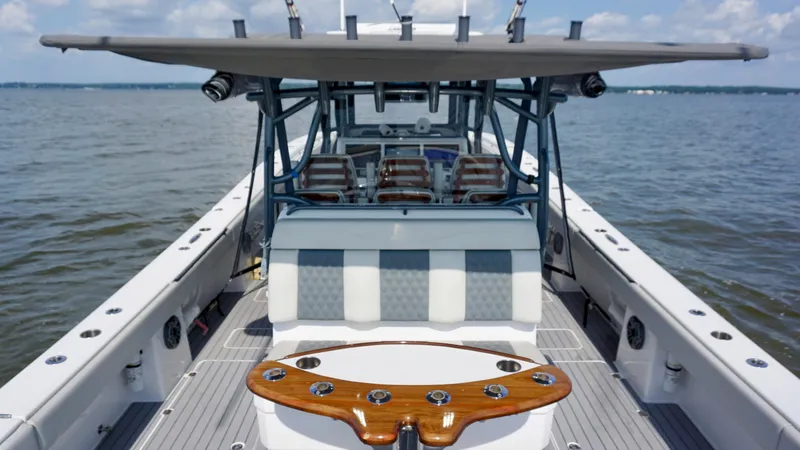  Yacht Photos Pics 2022 Invincible 46 Catamaran on open water, showcasing spacious deck and seating.