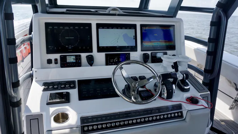  Yacht Photos Pics Control panel of 2022 Invincible 46 Catamaran with advanced navigation and steering systems.