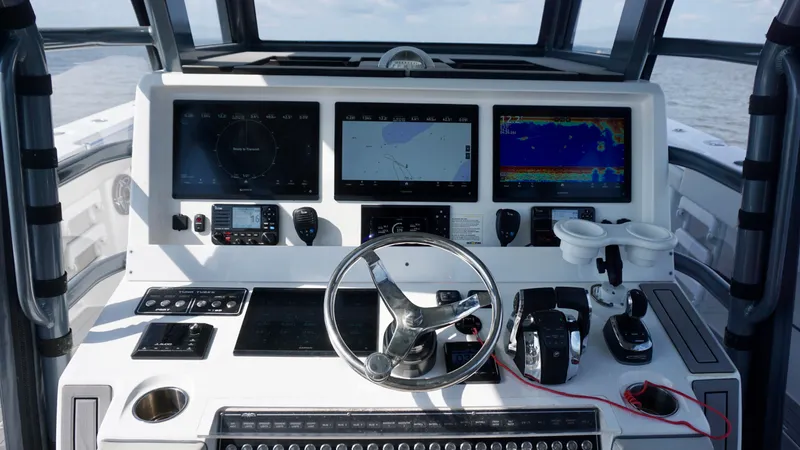  Yacht Photos Pics Cockpit of 2022 Invincible 46 Catamaran with advanced navigation displays and controls.