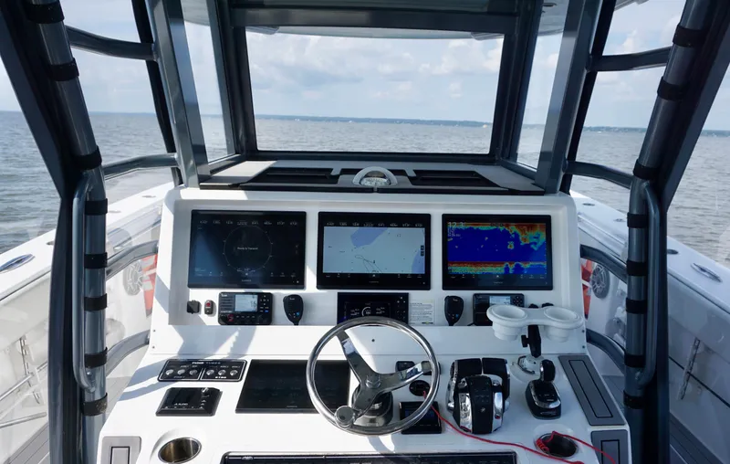  Yacht Photos Pics Cockpit view of 2022 Invincible 46 Catamaran with advanced navigation displays.