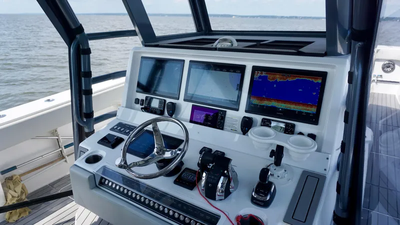  Yacht Photos Pics Helm of 2022 Invincible 46 Catamaran with advanced navigation displays and controls.