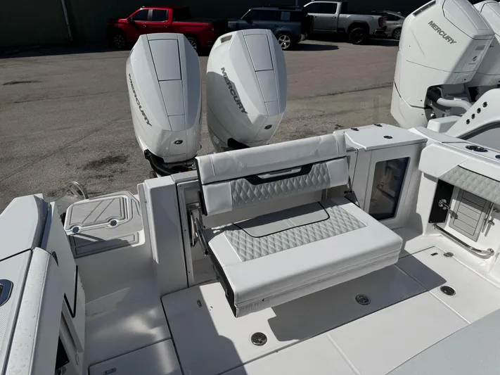  Yacht Photos Pics 2025 Blackfin 332 CC boat with dual Mercury engines and foldable seating.