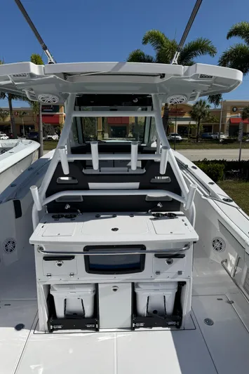  Yacht Photos Pics 2025 Blackfin 332 CC boat interior with fishing rod holders and storage compartments.