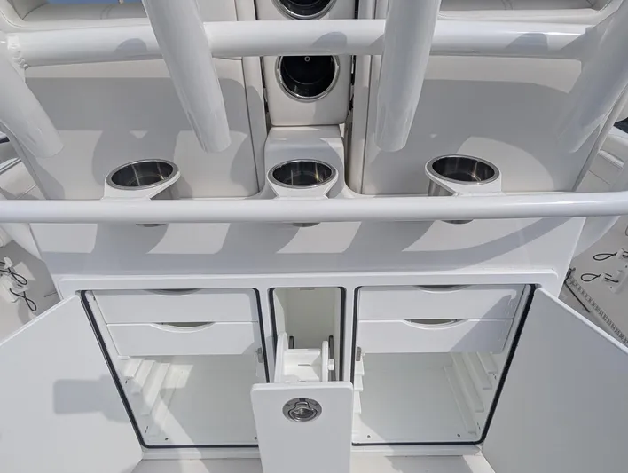  Yacht Photos Pics 2023 Regulator 28 boat interior with storage compartments and cup holders.