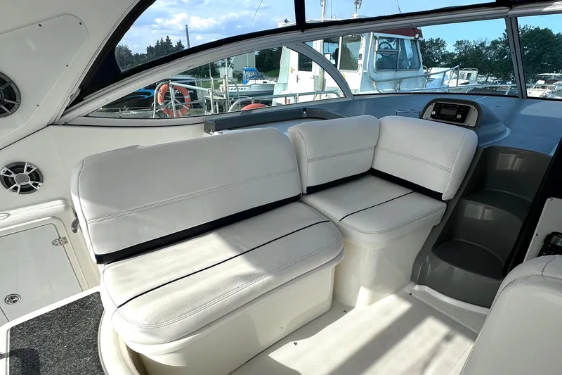  Yacht Photos Pics 2006 Cruisers Yachts 420 Express interior with white seating and modern dashboard.