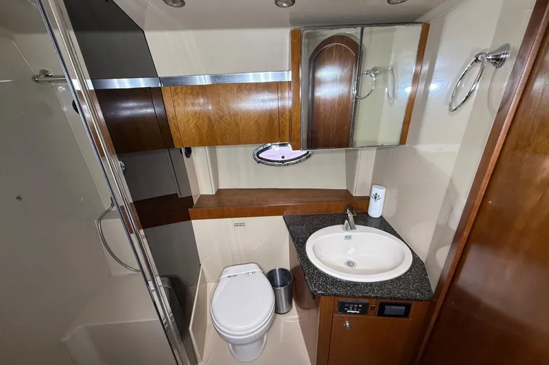  Yacht Photos Pics Bathroom interior of 2006 Cruisers Yachts 420 Express with sink, toilet, and shower.