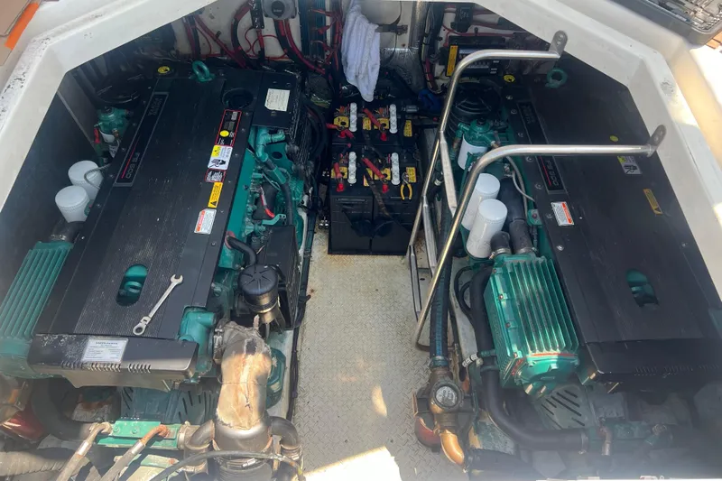  Yacht Photos Pics Engine compartment of a 2006 Cruisers Yachts 420 Express, featuring dual engines and batteries.