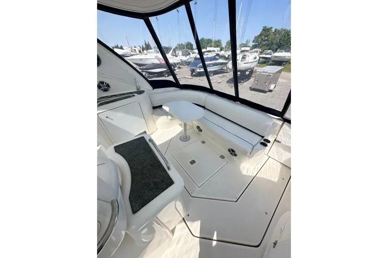  Yacht Photos Pics 2006 Cruisers Yachts 420 Express interior with white seating and panoramic windows.