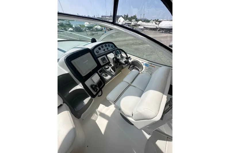  Yacht Photos Pics 2006 Cruisers Yachts 420 Express helm with modern controls and comfortable seating.