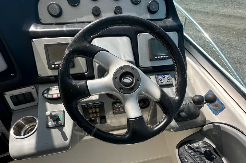  Yacht Photos Pics Steering wheel and controls of 2006 Cruisers Yachts 420 Express boat.