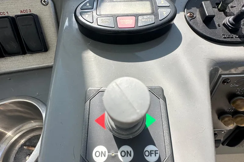  Yacht Photos Pics Control panel of a 2006 Cruisers Yachts 420 Express with joystick and buttons.