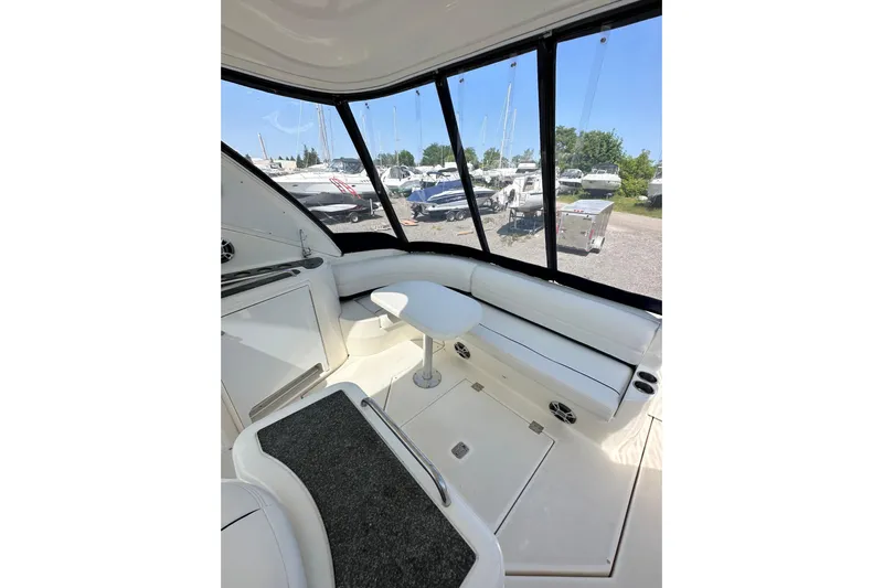  Yacht Photos Pics Interior of 2006 Cruisers Yachts 420 Express with white seating and table.