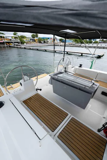 Orion Yacht Photos Pics 2017 Beneteau Oceanis 41.1 sailboat cockpit with teak flooring and dual steering wheels.