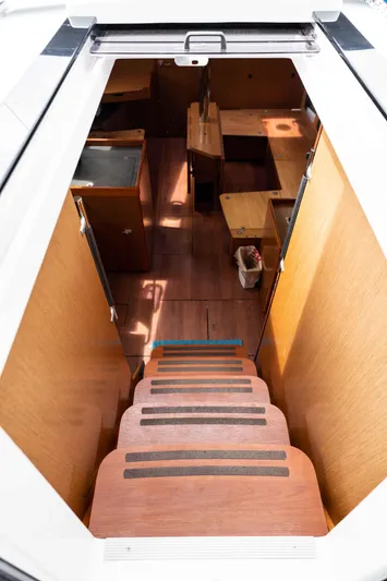 Orion Yacht Photos Pics Interior view of 2017 Beneteau Oceanis 41.1 sailboat, showcasing wooden stairs and cabin layout.
