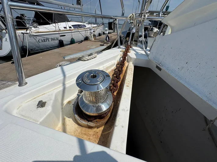 Halcyon Yacht Photos Pics 2017 Beneteau Oceanis 48 anchor chain and windlass on deck, docked at marina.