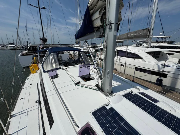 Halcyon Yacht Photos Pics 2017 Beneteau Oceanis 48 sailboat docked, featuring solar panels and sleek design.