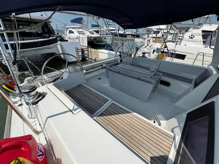 Halcyon Yacht Photos Pics 2017 Beneteau Oceanis 48 yacht cockpit with dual steering wheels and spacious seating.