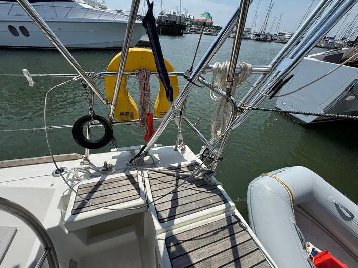 Halcyon Yacht Photos Pics 2017 Beneteau Oceanis 48 yacht deck with safety equipment and inflatable dinghy.