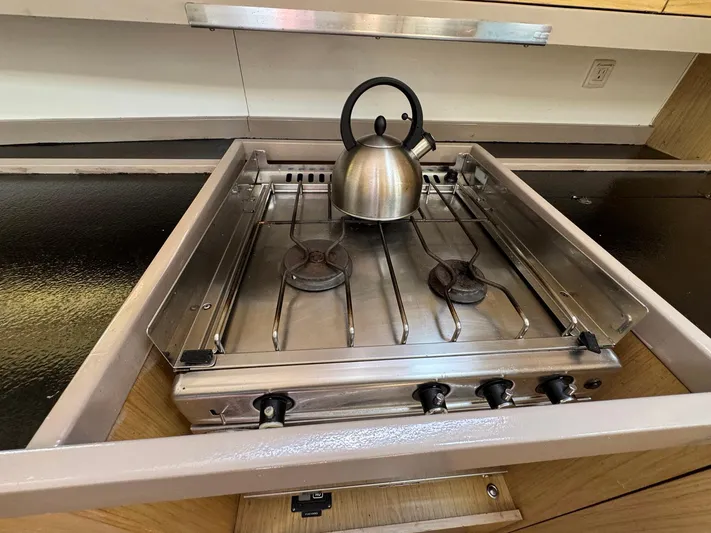 Halcyon Yacht Photos Pics Stainless steel stove with kettle on Beneteau Oceanis 48 yacht, 2017 model.