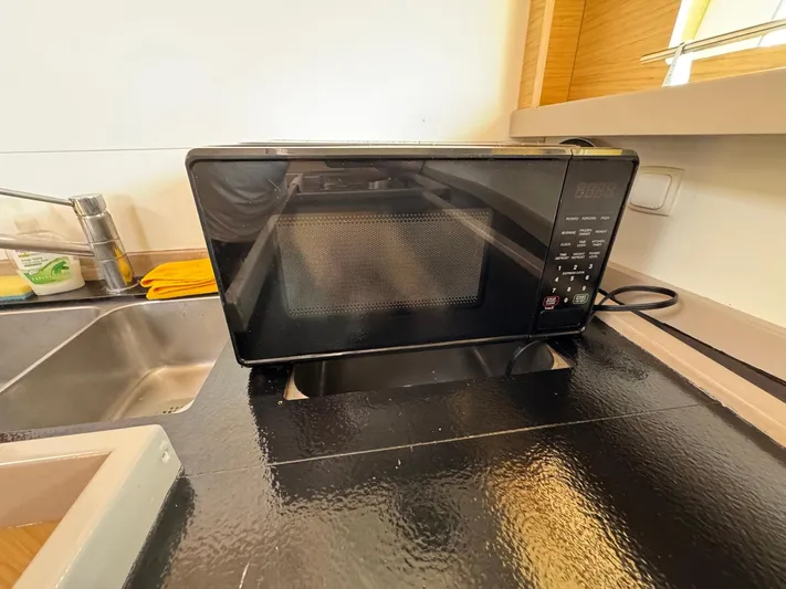 Halcyon Yacht Photos Pics Microwave on Beneteau Oceanis 48 yacht kitchen counter, 2017 model.