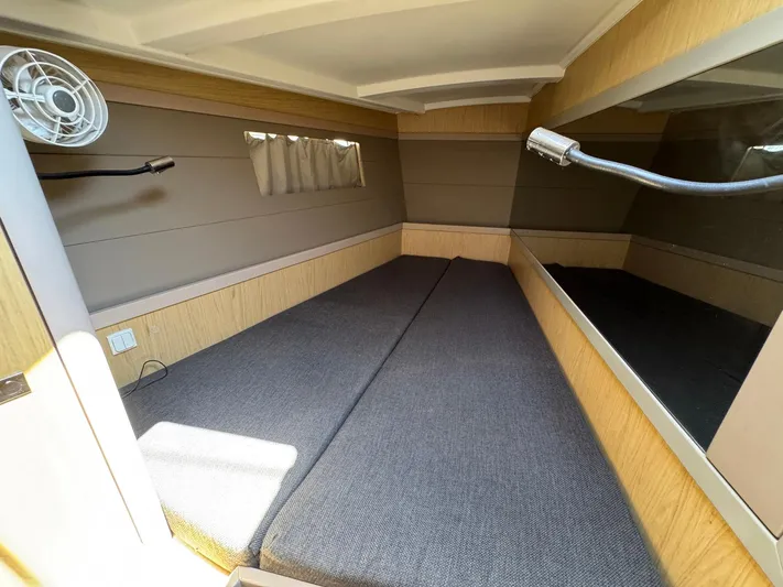 Halcyon Yacht Photos Pics 2017 Beneteau Oceanis 48 cabin interior with modern design and comfortable bedding.