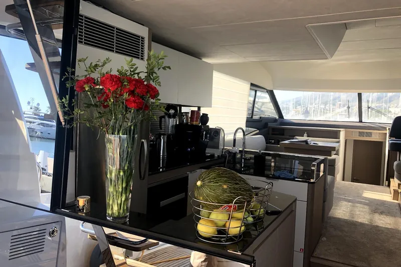  Yacht Photos Pics Luxurious 2019 Prestige 590 yacht interior with modern kitchen and elegant decor.