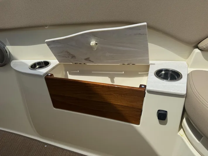  Yacht Photos Pics Interior of 2025 Chris-Craft Catalina 28 with storage compartment and cup holders.