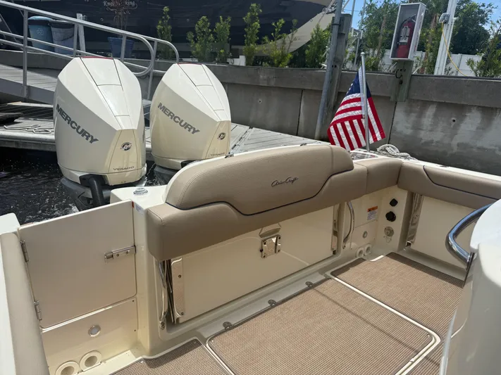 Yacht Photos Pics 2025 Chris-Craft Catalina 28 boat with Mercury engines and American flag at dock.