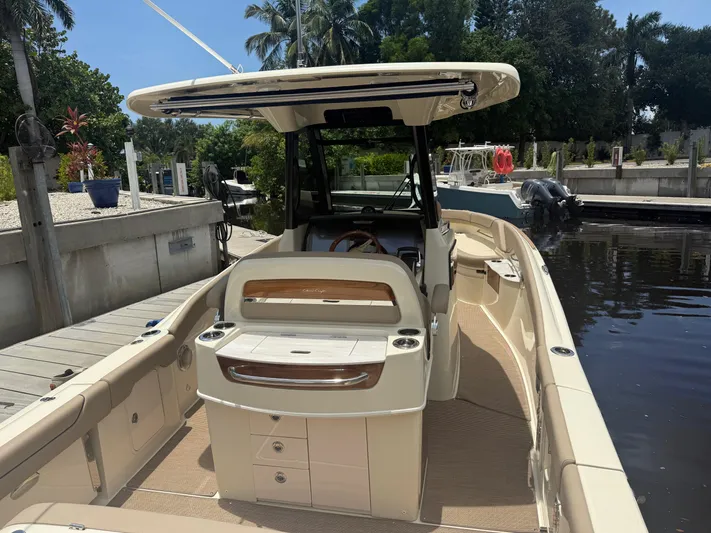  Yacht Photos Pics 2025 Chris-Craft Catalina 28 boat docked, showcasing sleek design and spacious deck.