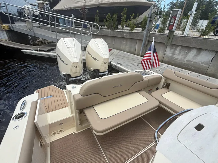  Yacht Photos Pics 2025 Chris-Craft Catalina 28 boat with twin Mercury engines docked by a pier.
