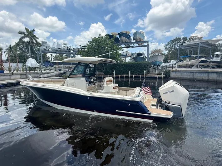  Yacht Photos Pics 2025 Chris-Craft Catalina 28 boat on water, featuring sleek design and Mercury outboard engine.