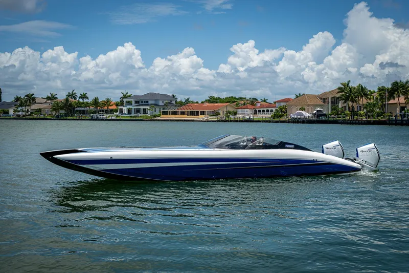  Yacht Photos Pics 2023 Performance Powerboats P360 on water, with luxury homes in the background.