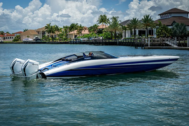  Yacht Photos Pics 2023 Performance Powerboats P360 on water, sleek design, dual engines, luxury waterfront homes in background.