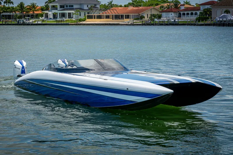  Yacht Photos Pics 2023 Performance Powerboats P360 on water, sleek design, blue and white color scheme.