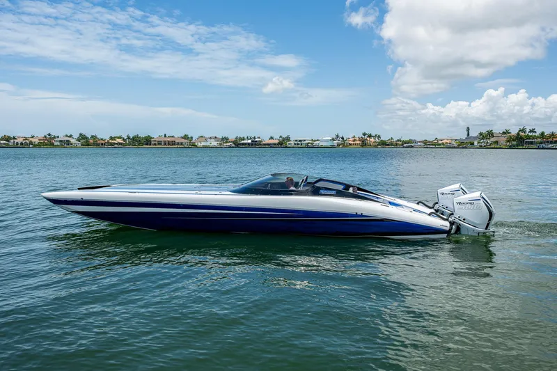  Yacht Photos Pics 2023 Performance Powerboats P360 on calm water under a clear blue sky.