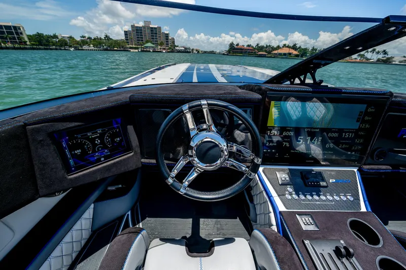  Yacht Photos Pics 2023 Performance Powerboats P360 cockpit with advanced navigation displays and sleek steering wheel.