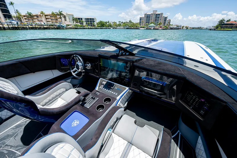  Yacht Photos Pics Luxurious 2023 Performance Powerboats P360 cockpit with modern controls and waterfront view.