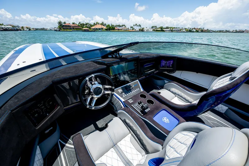  Yacht Photos Pics 2023 Performance Powerboats P360 cockpit with luxurious seating and advanced navigation system on the water.