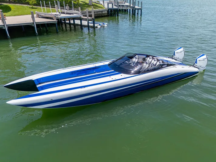  Yacht Photos Pics 2023 Performance Powerboats P360 in water, sleek design with blue and white stripes.