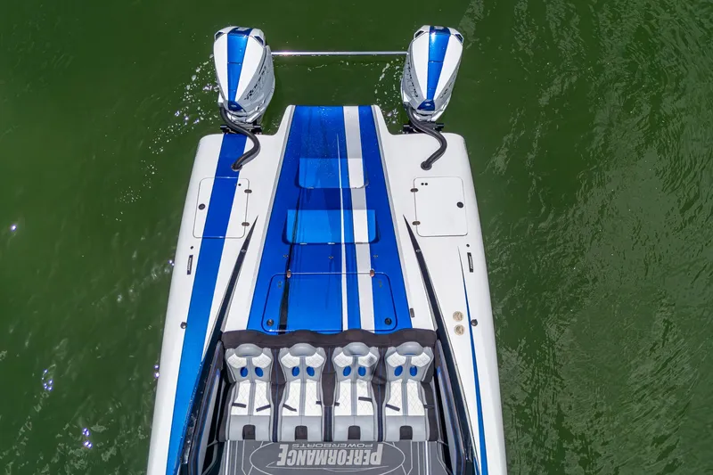  Yacht Photos Pics 2023 Performance Powerboats P360, aerial view, blue and white design, on green water.